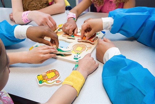 Hong Kong insurer’s employees spread holiday cheer to hospitalised children